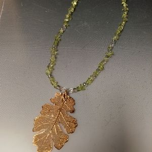 Gold Skelton leaf Olivine crystal necklace 22in 3in pendant